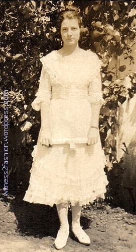 Eighth grade graduation day, 1919. I "pushed" the photo to clarify the ruffles on her dress. which arn't visible in the official photographs.